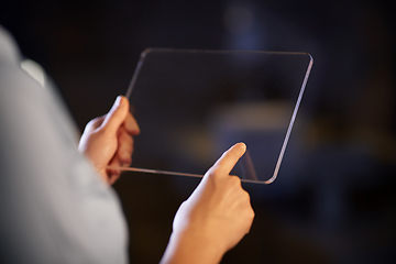 Image showing hands with transparent tablet pc computer