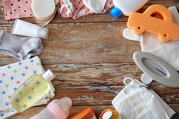 Image showing baby accessories for bathing on wooden table