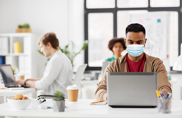 Image showing indian man with laptop in medical mask at office