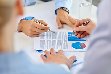 Image showing business team hands with pens and charts at office