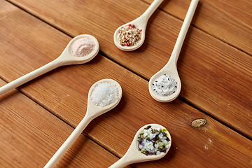 Image showing spoons with salt and spices on wooden table