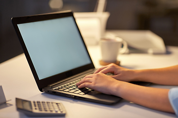 Image showing businesswoman with laptop at dark night office