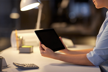 Image showing businesswoman with tablet computer at night office