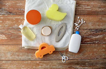 Image showing baby accessories for bathing on wooden table