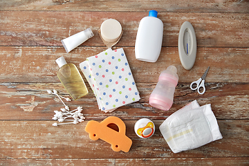 Image showing baby accessories for bathing on wooden table