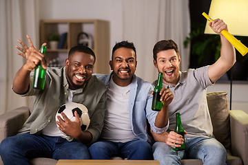 Image showing friends or soccer fans with ball and beer at home