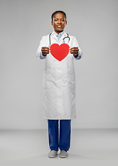 Image showing african american female doctor with red heart