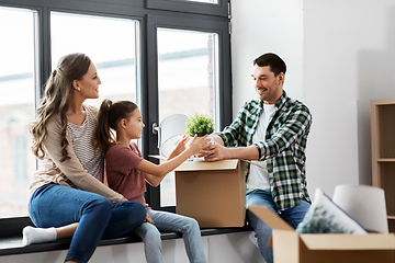 Image showing happy family with child moving to new home