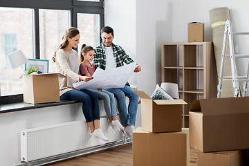 Image showing happy family with blueprint moving to new home