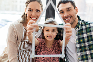 Image showing happy family with folding ruler moving to new home