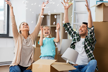 Image showing happy family playing with foam peanuts at new home