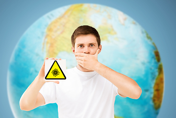 Image showing scared man with coronavirus sign over earth planet