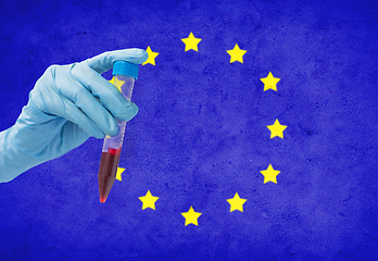 Image showing hand holding test tube with coronavirus blood test