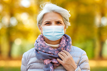 Image showing senior woman in protective medical mask at park