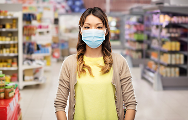 Image showing asian young woman in protective medical mask