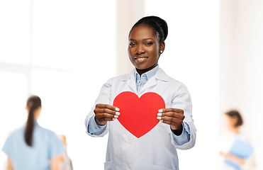 Image showing african american female doctor with red heart