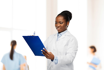 Image showing african american female doctor with clipboard