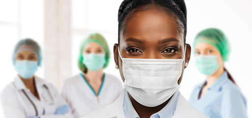 Image showing african american doctor in medical mask at clinic