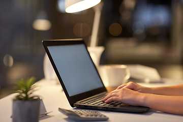 Image showing businesswoman with laptop at dark night office