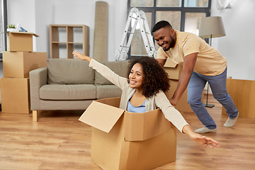 Image showing happy couple moving to new home and having fun