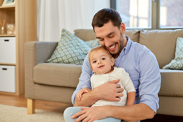 Image showing father with little baby daughter at home