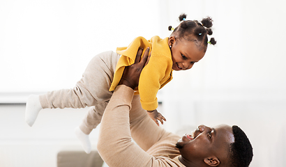 Image showing happy african american father with baby at home