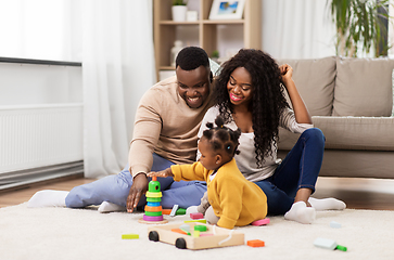 Image showing african family playing with baby daughter at home