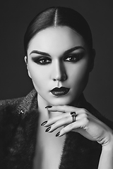 Image showing beautiful young woman with dark makeup