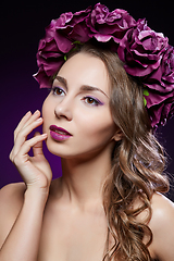 Image showing beautiful girl with purple makeup and flowers