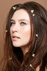 Image showing girl with many small flowers in long hair