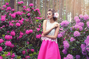 Image showing girl in dress in rhododendron garden