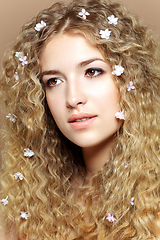 Image showing girl with many small flowers in long hair