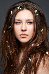 Image showing girl with many small flowers in long hair