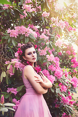 Image showing girl in dress in rhododendron garden