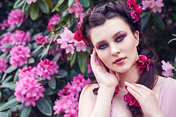 Image showing girl in dress in rhododendron garden