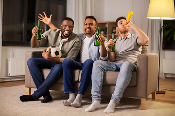 Image showing friends or soccer fans with ball and beer at home