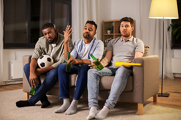 Image showing sad friends with ball and vuvuzela watching soccer