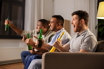 Image showing friends or soccer fans with ball and beer at home