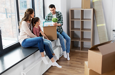 Image showing happy family with child moving to new home