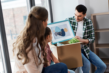 Image showing happy family with child moving to new home