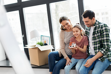 Image showing happy family with house model moving to new home