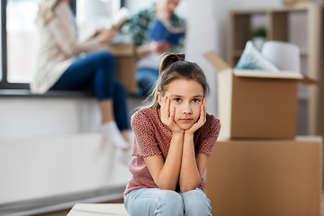 Image showing sad girl moving to new home with her family