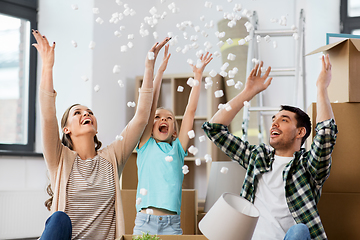 Image showing happy family playing with foam peanuts at new home