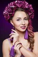 Image showing beautiful girl with purple makeup and flowers