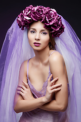 Image showing beautiful girl with purple makeup and flowers