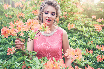 Image showing girl in dress in rhododendron garden