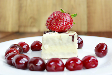 Image showing ripe red strawberries and cherries with cake