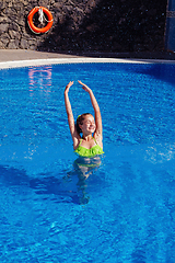 Image showing teen girl relaxing near swimming pool