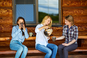 Image showing young women drinking tea