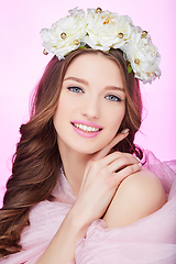 Image showing beautiful happy girl with pink makeup and flowers